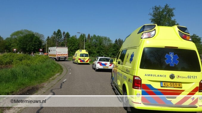 persoon onder trein Nijeveen